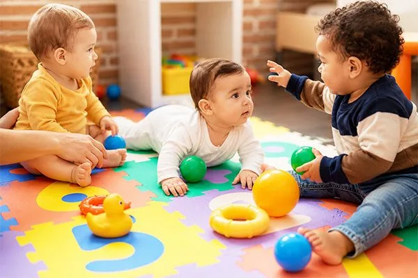 Infants learning through sensory play at Kinder Grove in Toronto